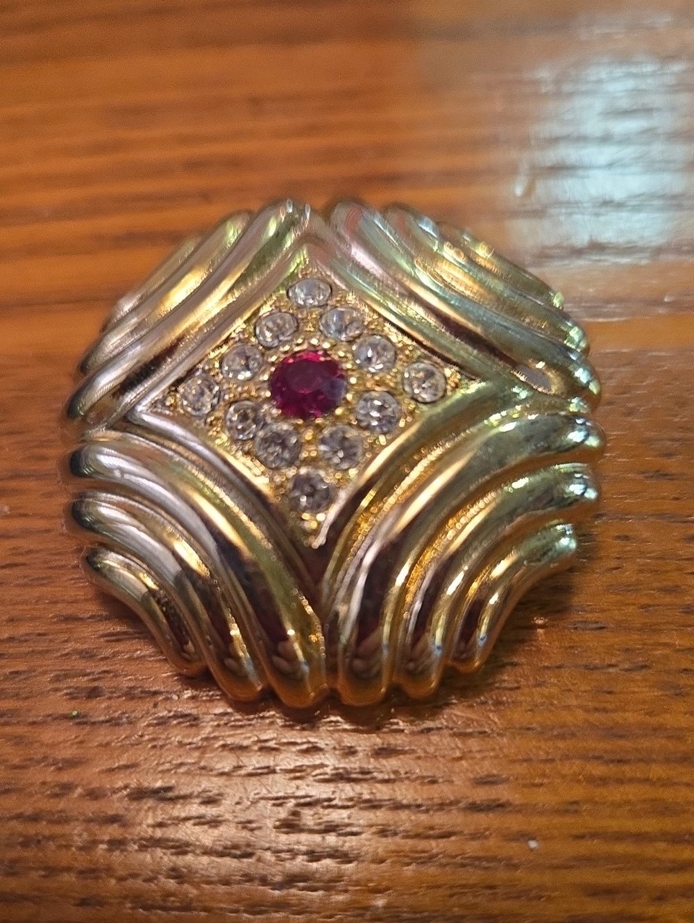 Gold-Tone Women's Brooch with Red Center Gem and Clear Stones